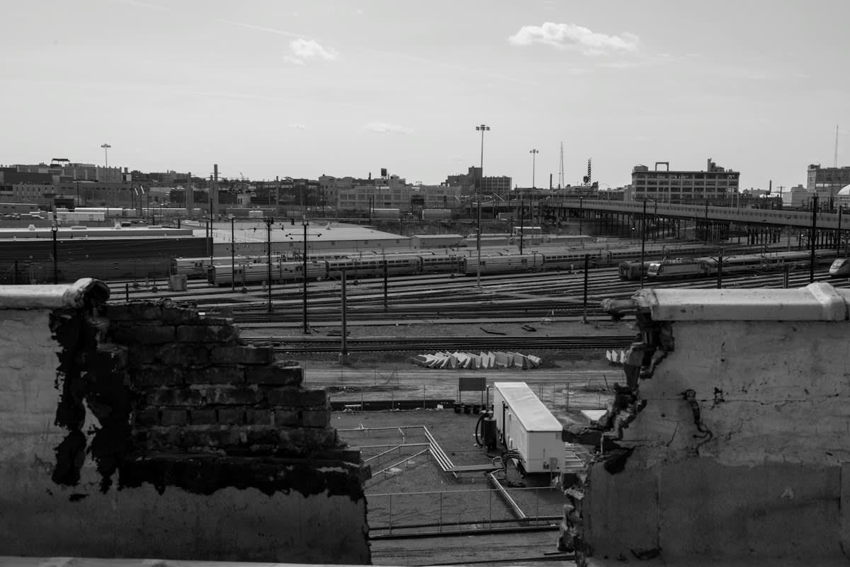 rusted rebar and concrete ruins in an industrial area