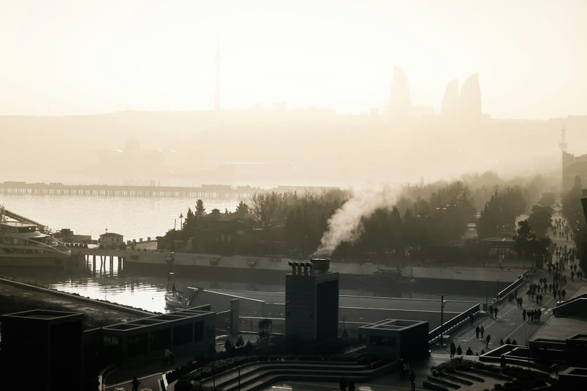 Industrial cooling towers in a hazy urban environment