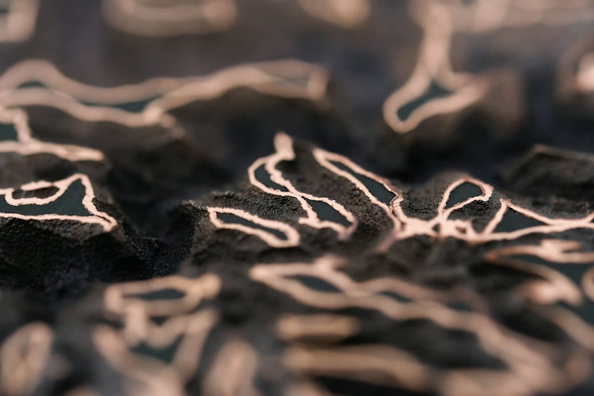 Close up of a silica glass chip with laser etchings
