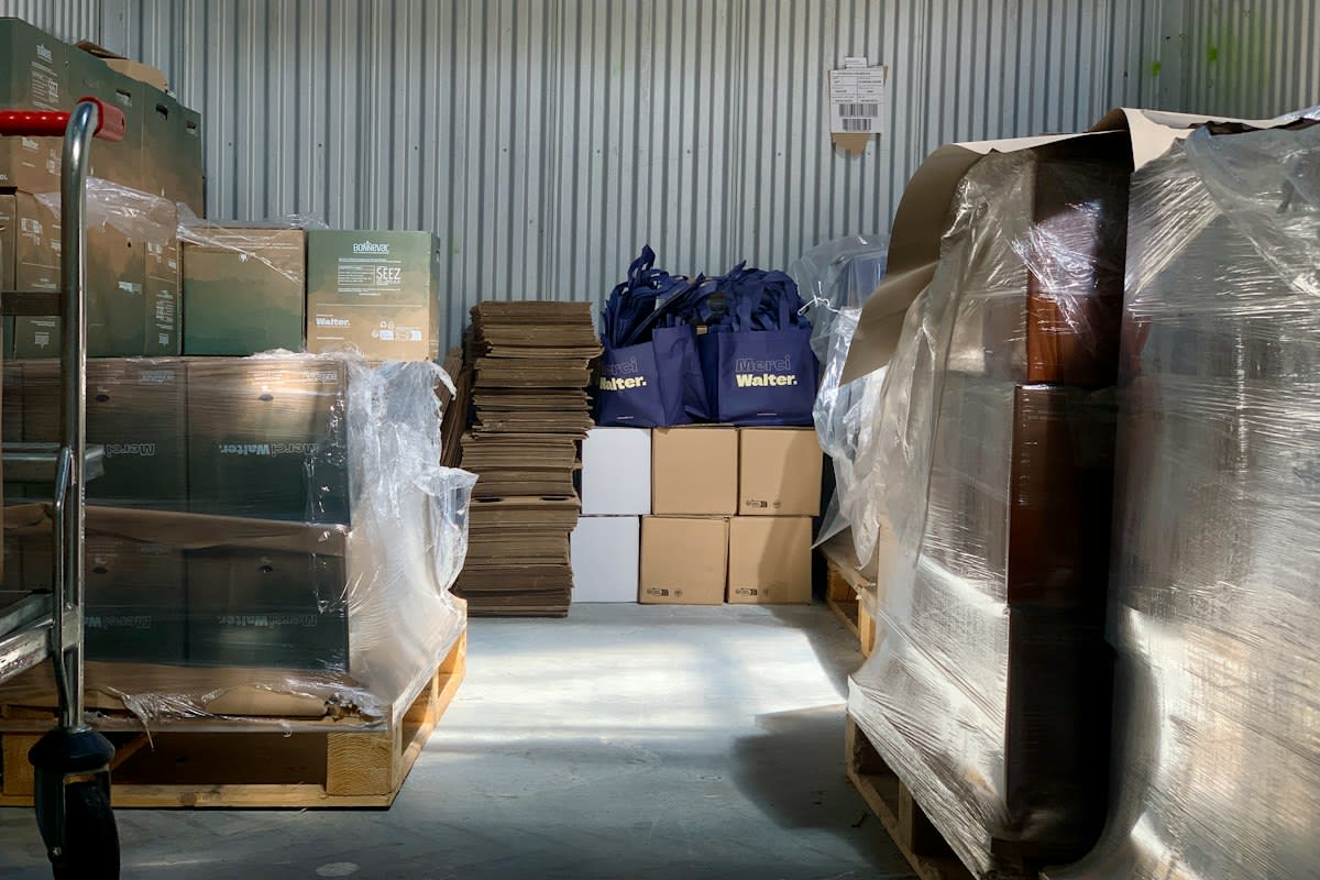 Logistics warehouse interior with shipping containers