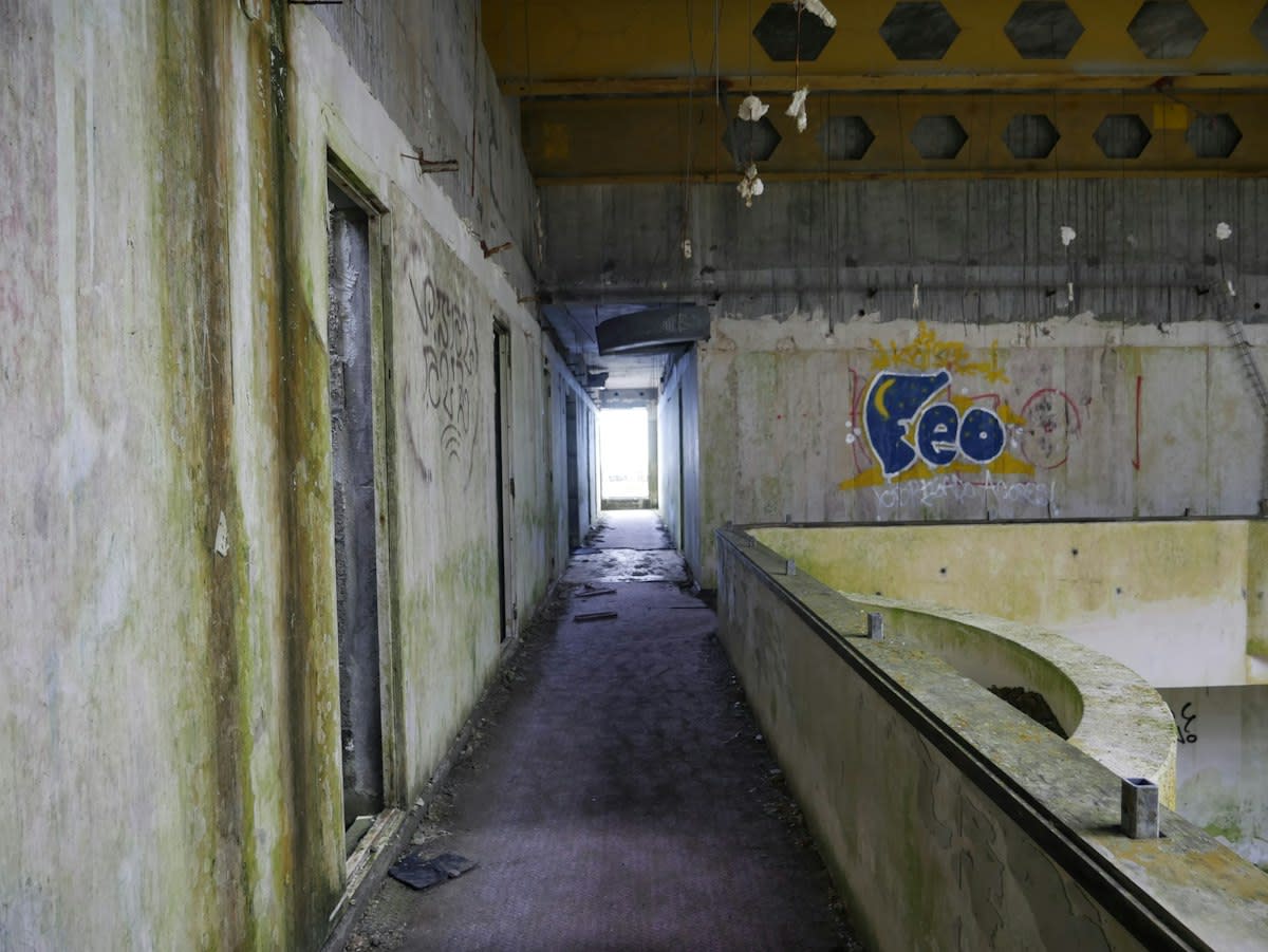 Abandoned mall with concrete floors and dust