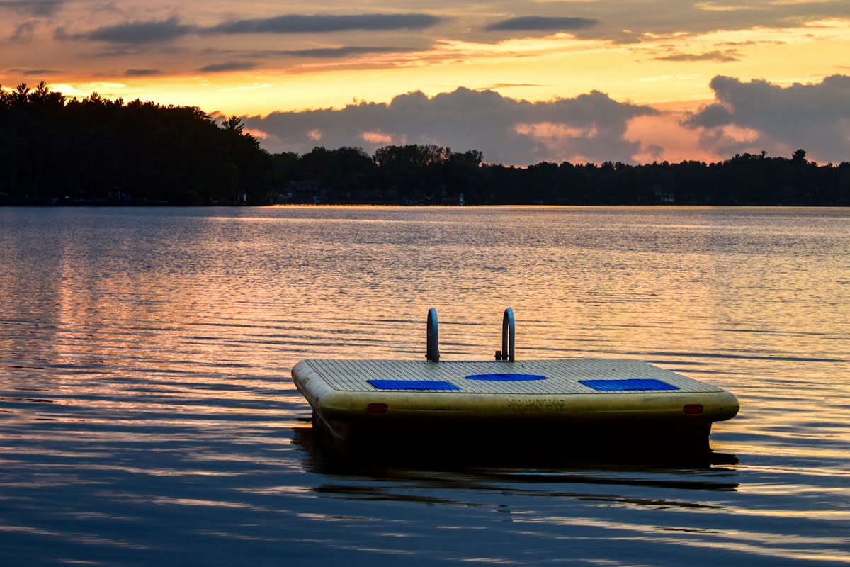 Floating solar panels on a calm lake
