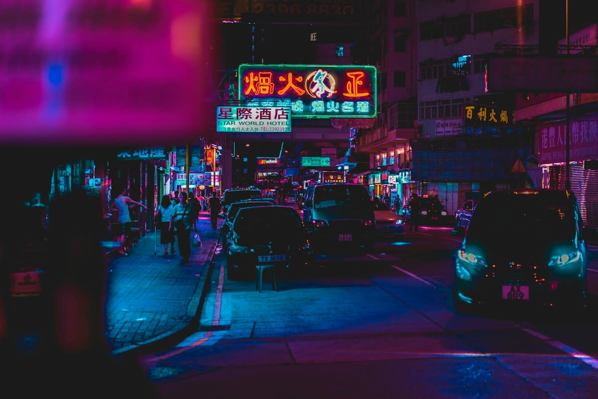 Decaying urban infrastructure with neon signs