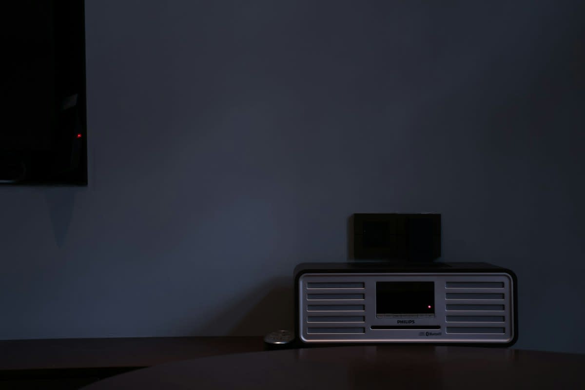 High-tech sleep tracker on a wrist in a dark room