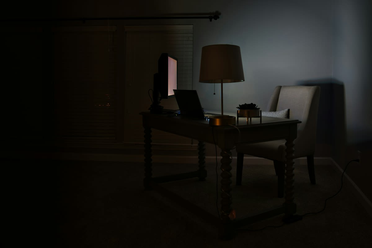 Digital screen showing weather alerts in a dark room