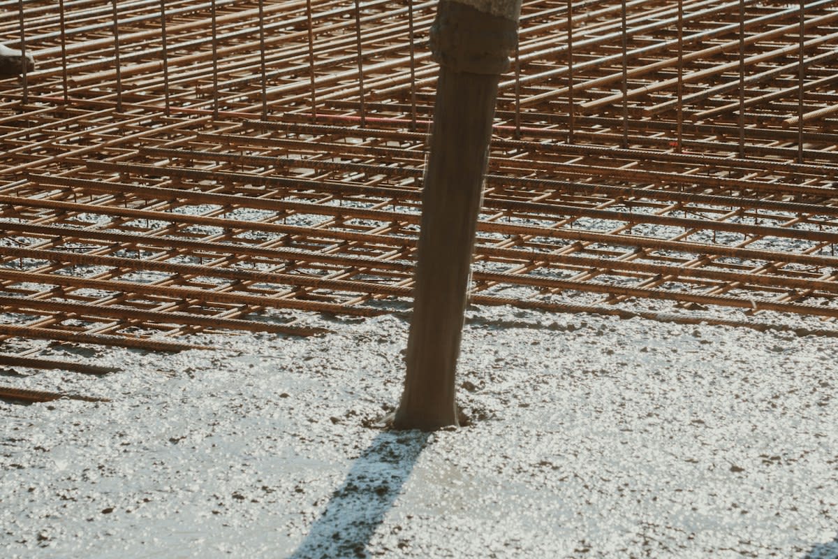 Steel rebar embedded in raw concrete
