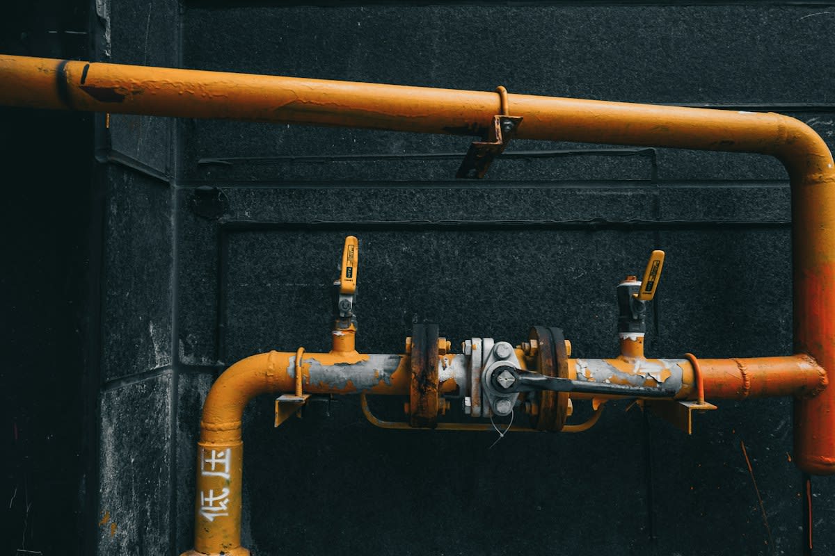 industrial plumbing tools and rusted pipes