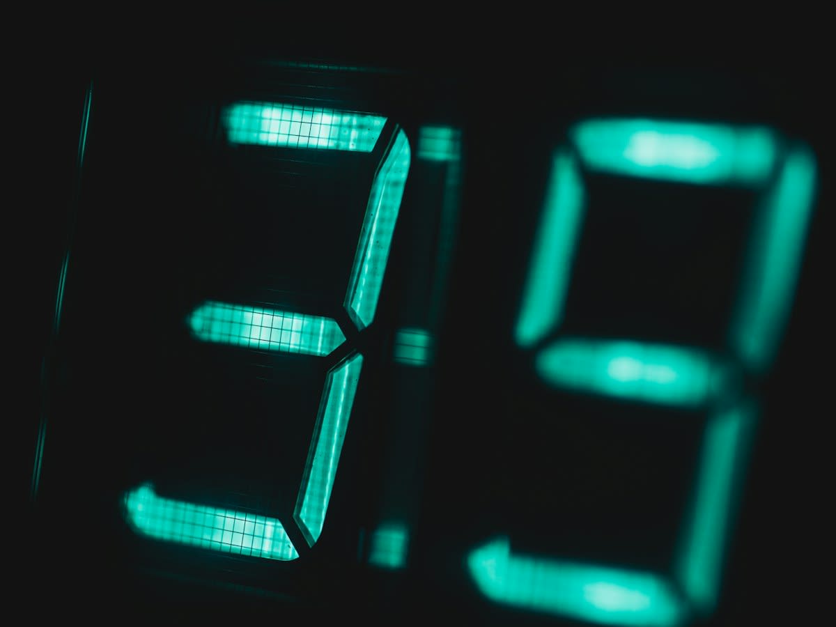 Close up of a digital clock showing 3 PM
