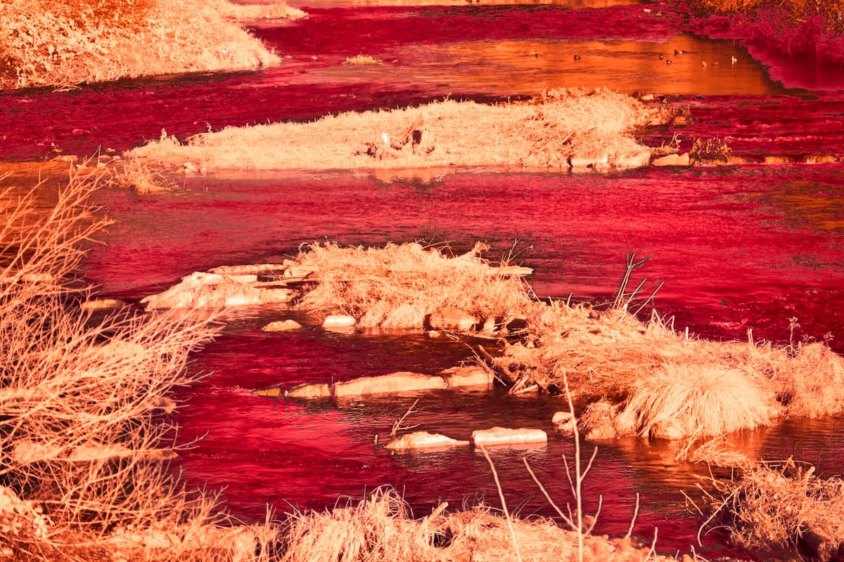 Industrial dye runoff in a river