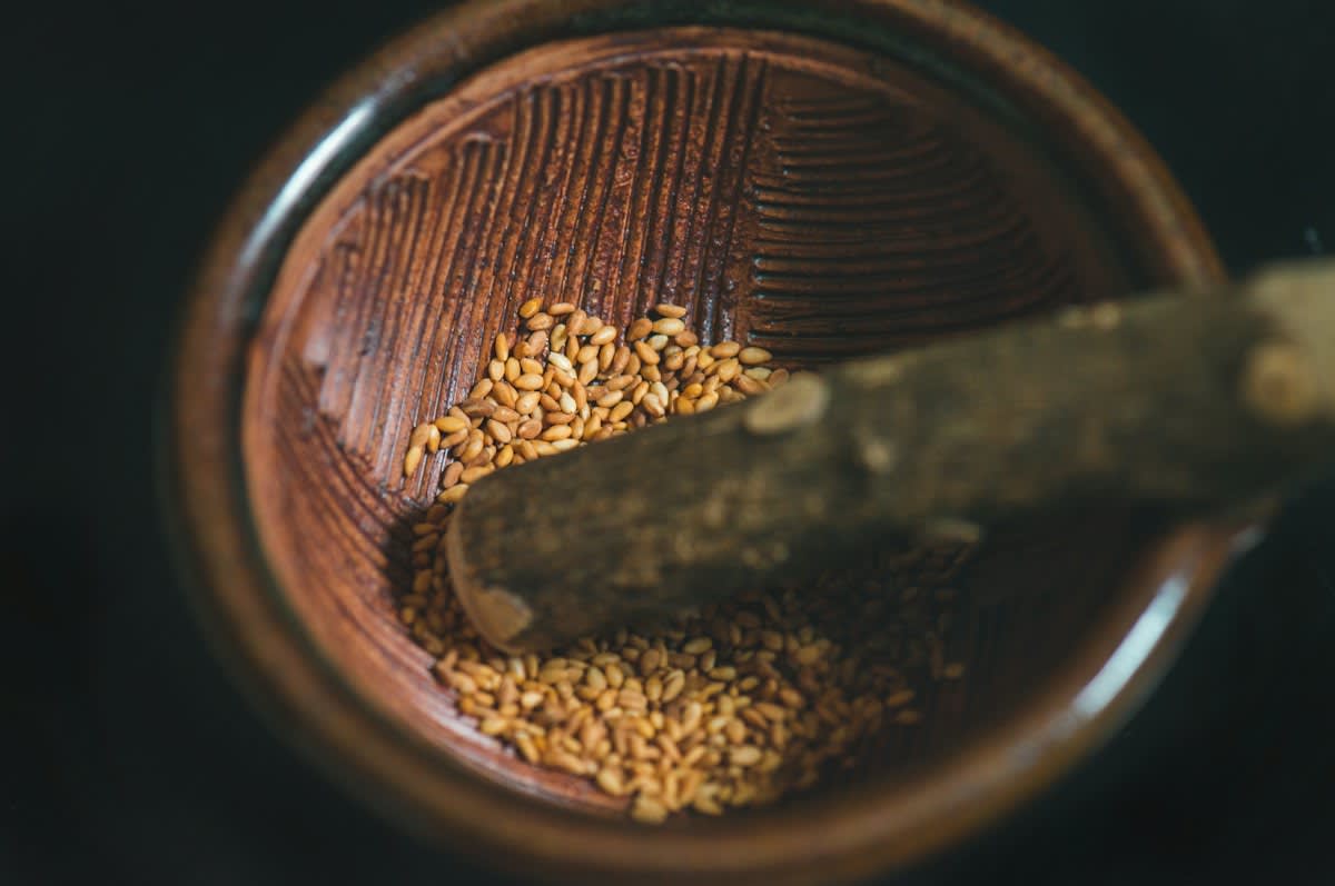Close up of old seeds in a glass jar