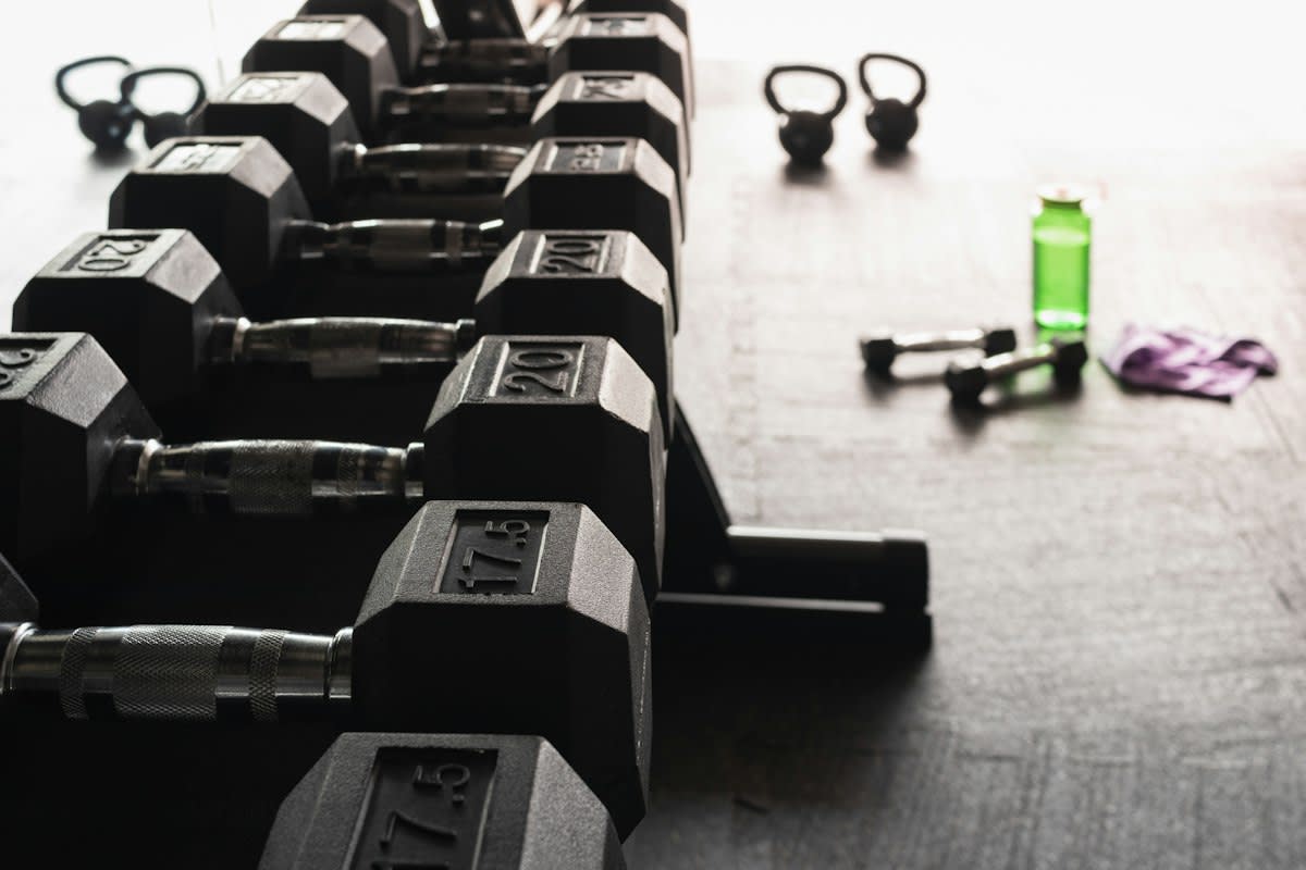 Heavy dumbbells on a gym floor