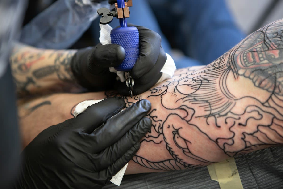 Close up of professional tattoo ink and needles