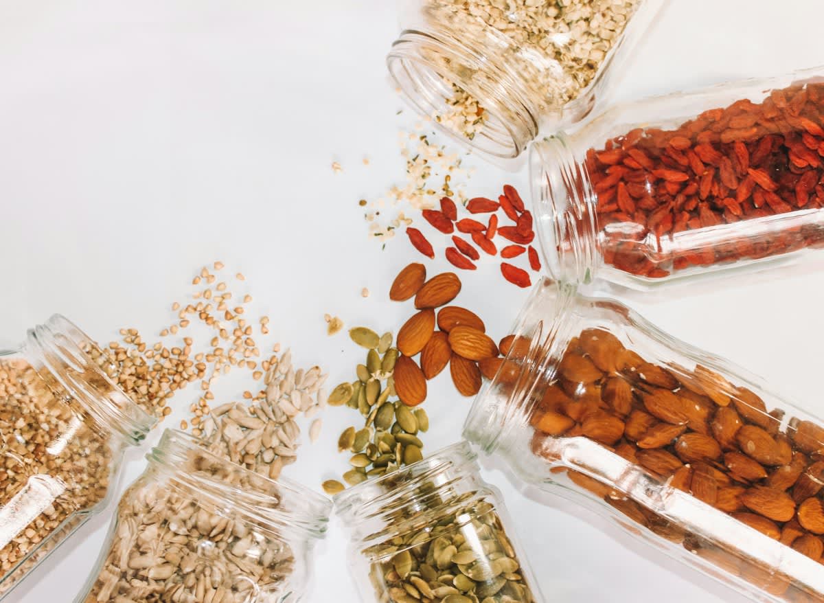 Close up of diverse seeds in glass vials