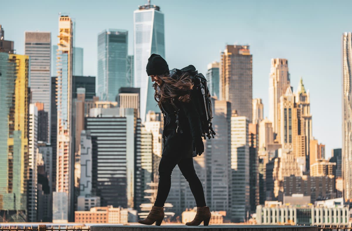 person walking through a modern city