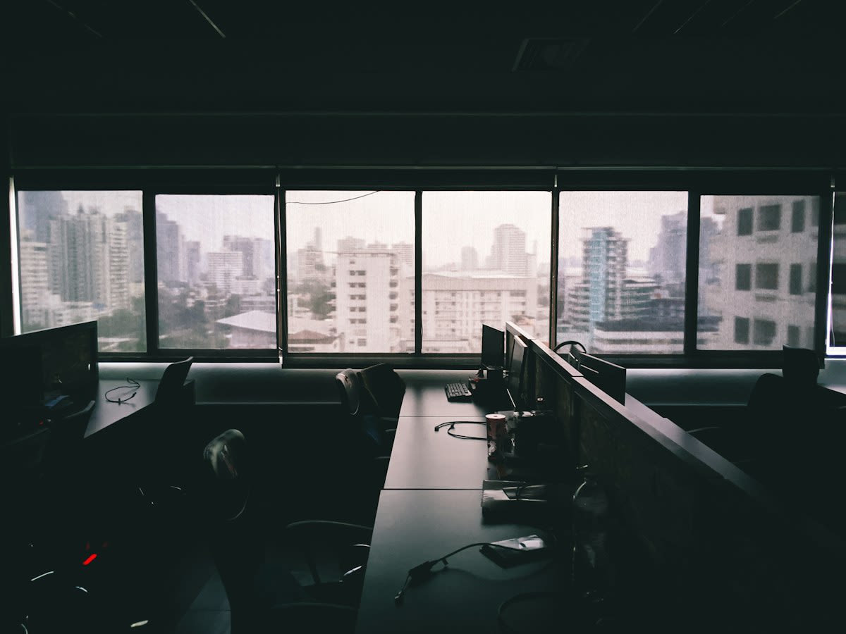 Blurred computer screen in a dark office