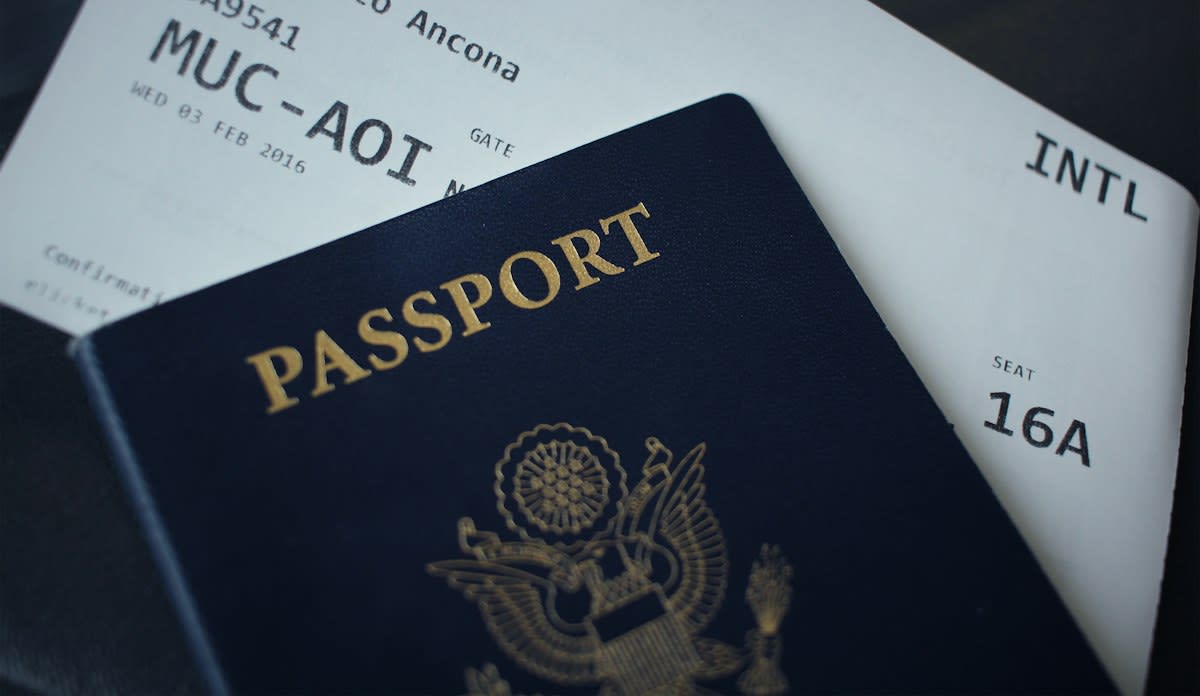Close up of a passport and boarding pass