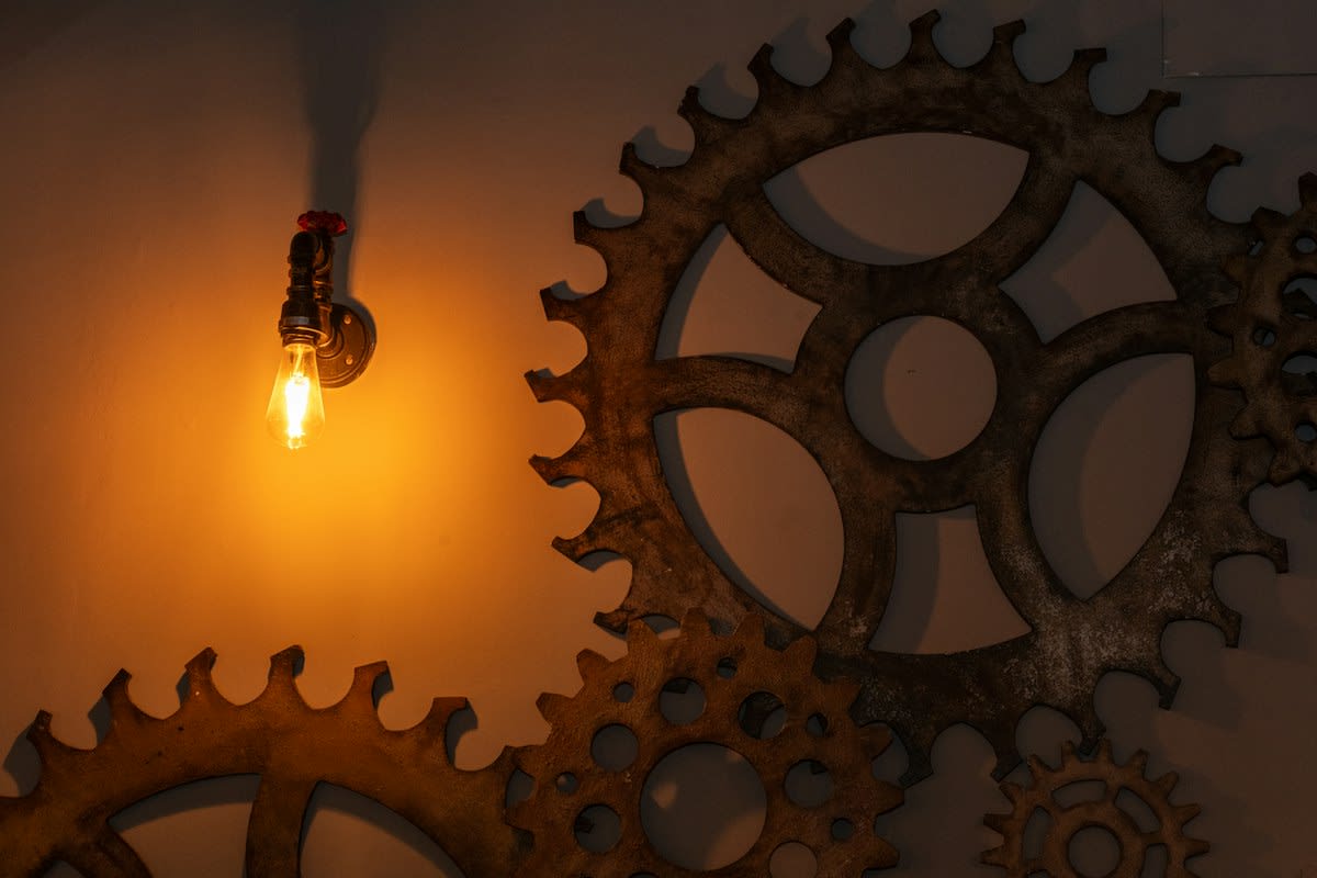 Abstract representation of a gear and a lightbulb