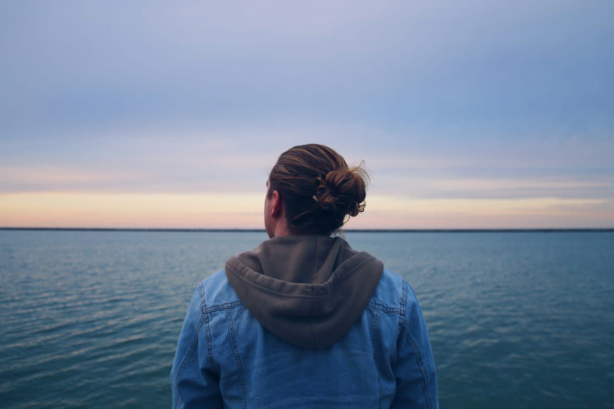person staring at a horizon