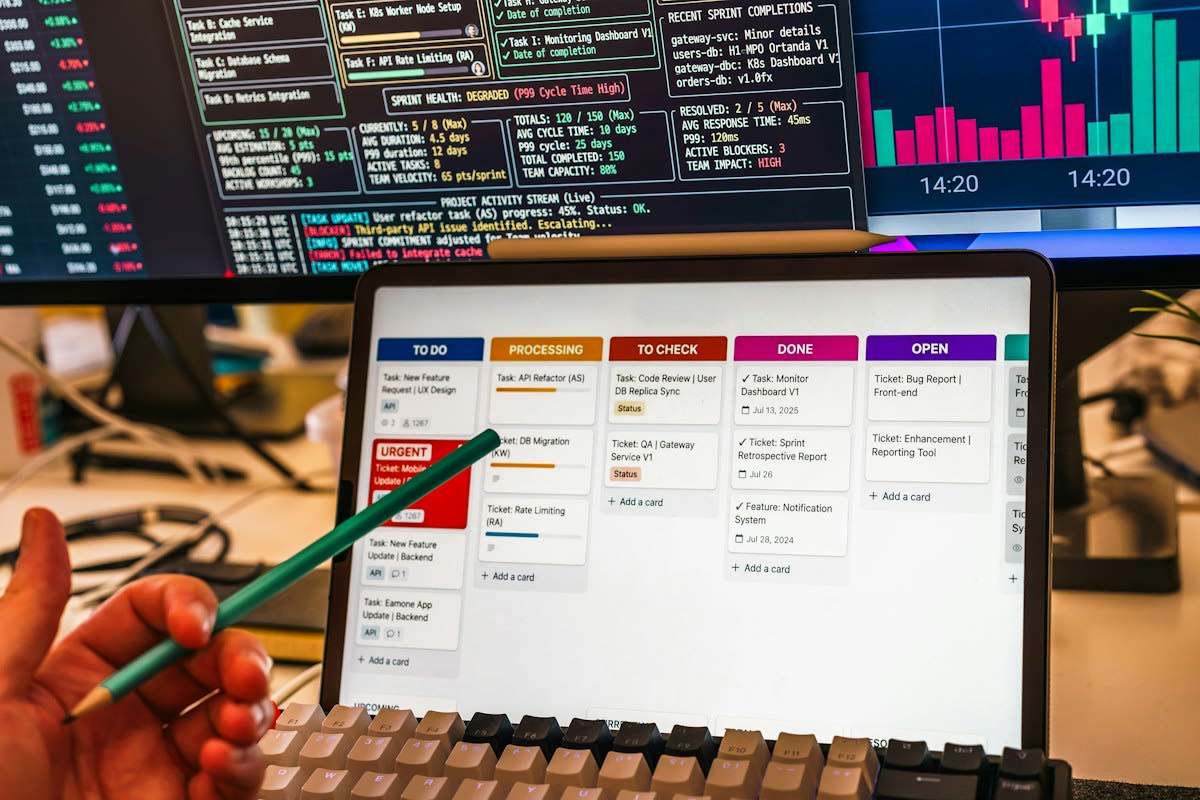 human hands pointing at digital screens with data points