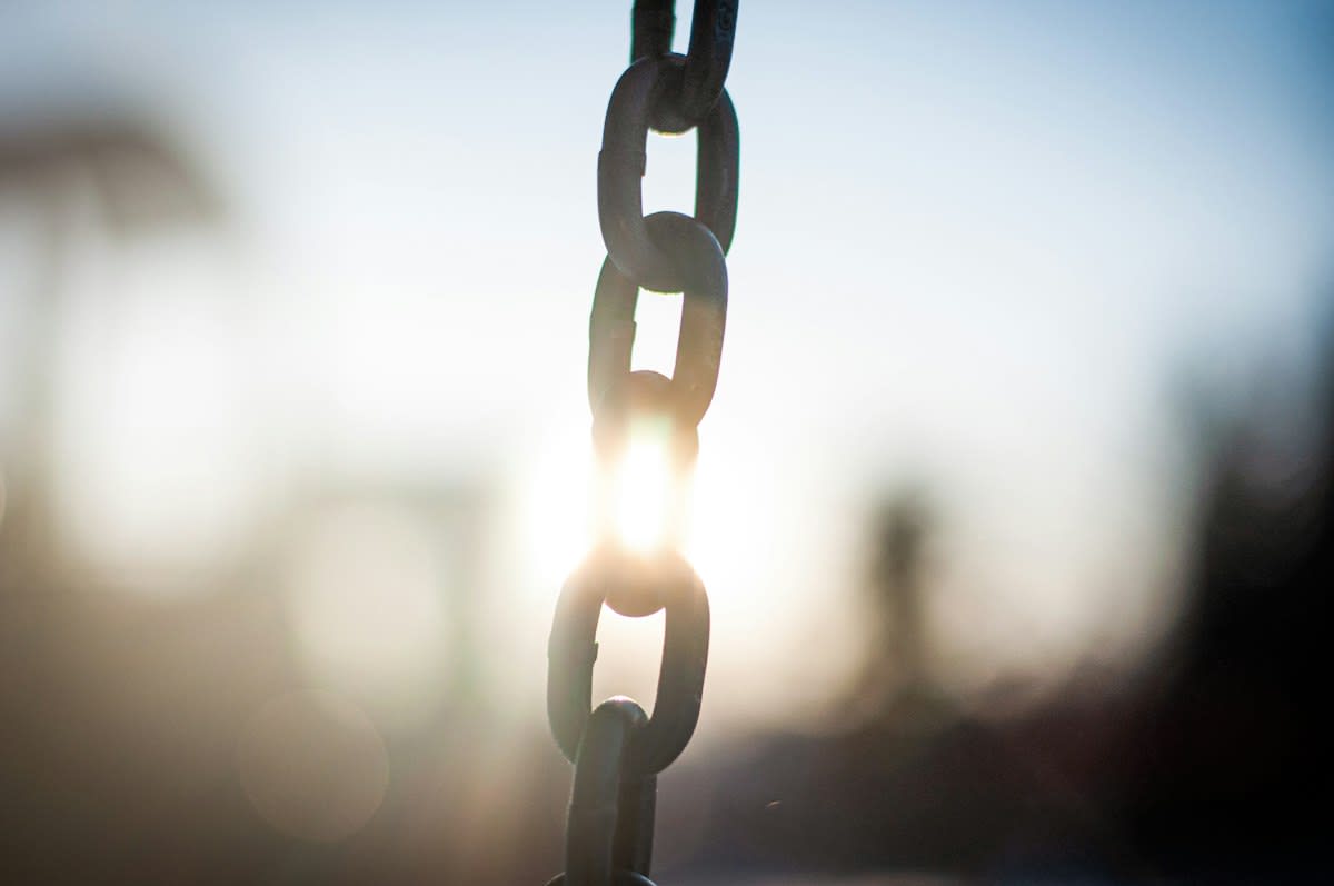 conceptual image of a broken chain