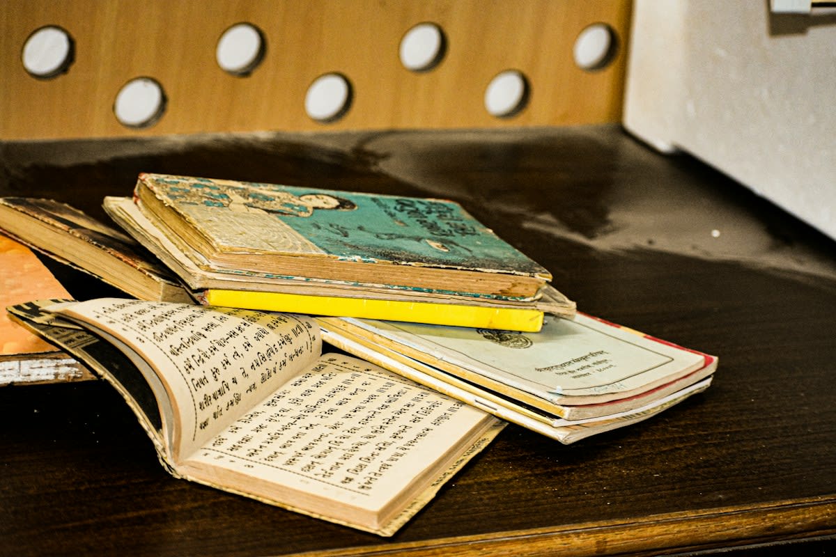 Ancient Buddhist manuscripts on a wooden table