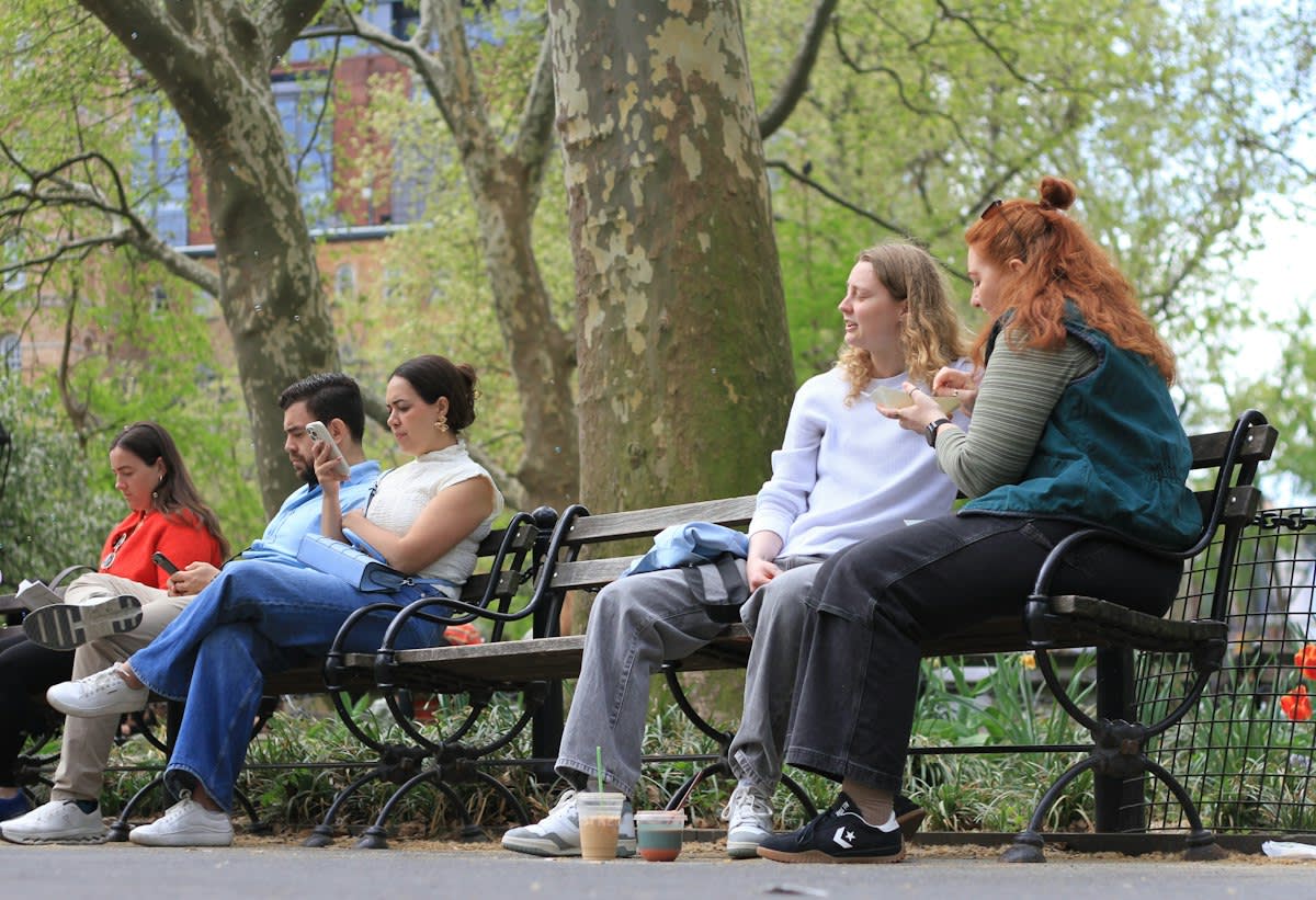Community members talking in a public park