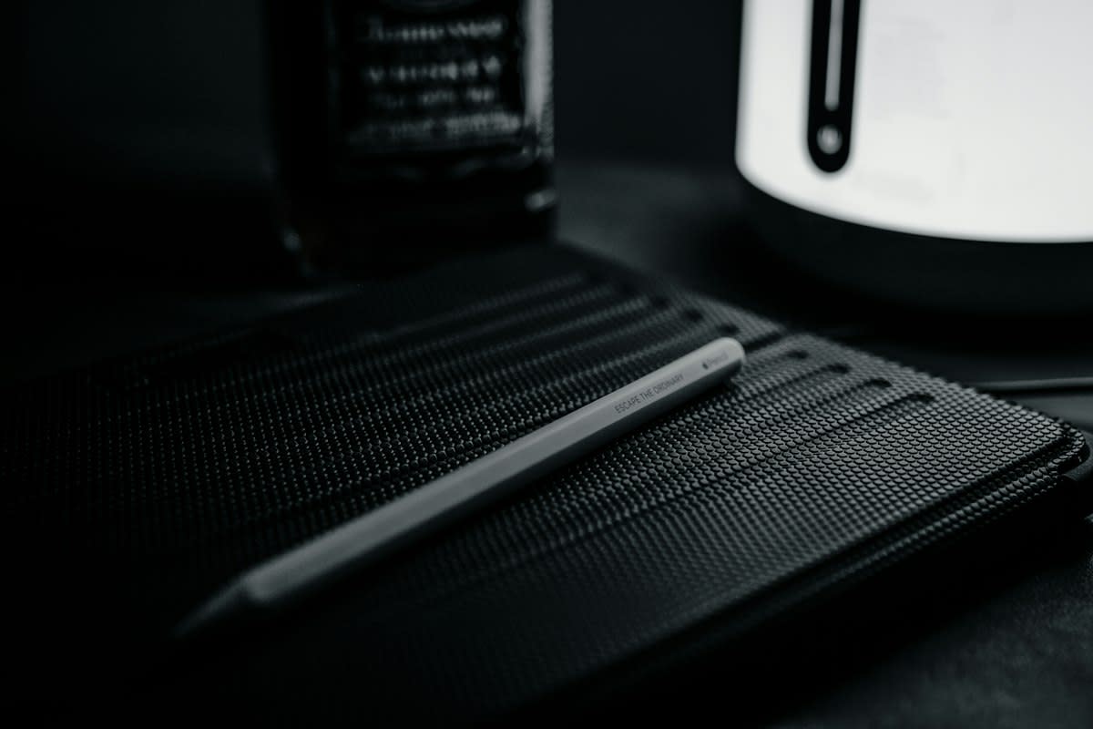 close up of charcoal drawing and digital tablet