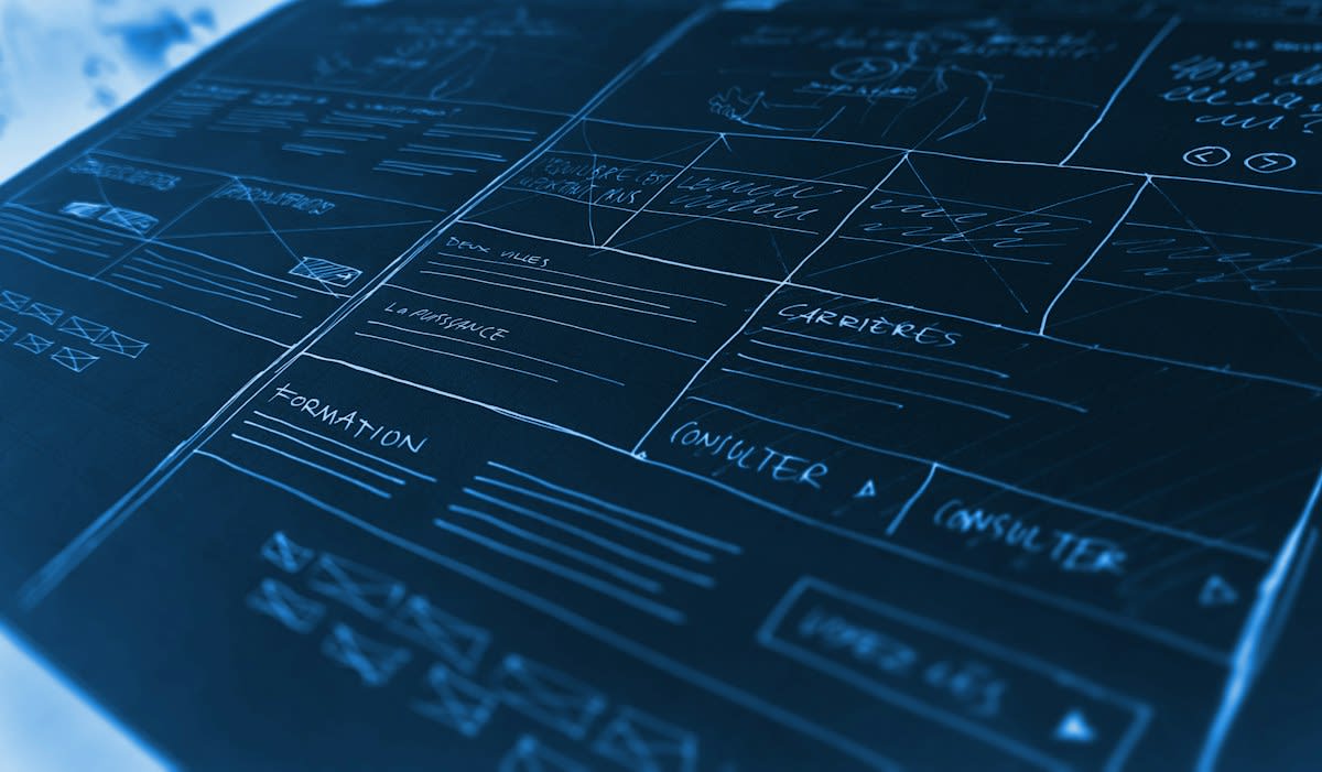 Paper blueprints and AI screen