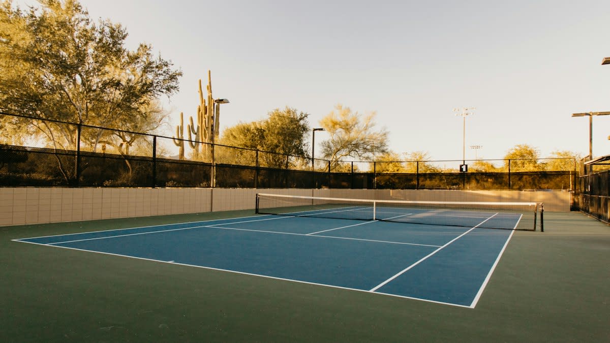 Tennis court with empty seats