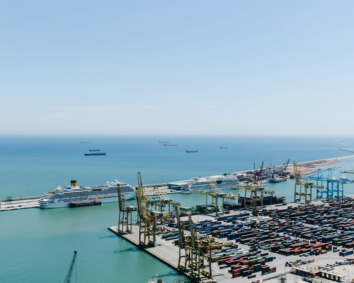 Cargo ship at a bustling industrial port