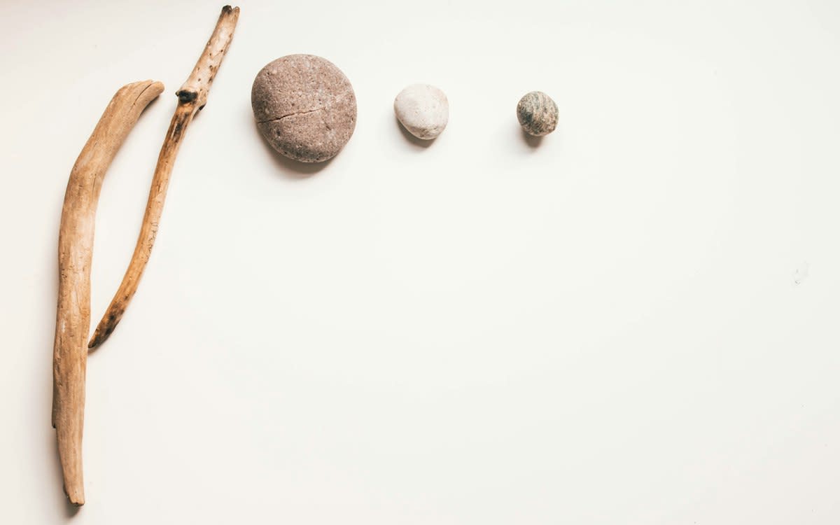 Prehistoric stone tools on a neutral background