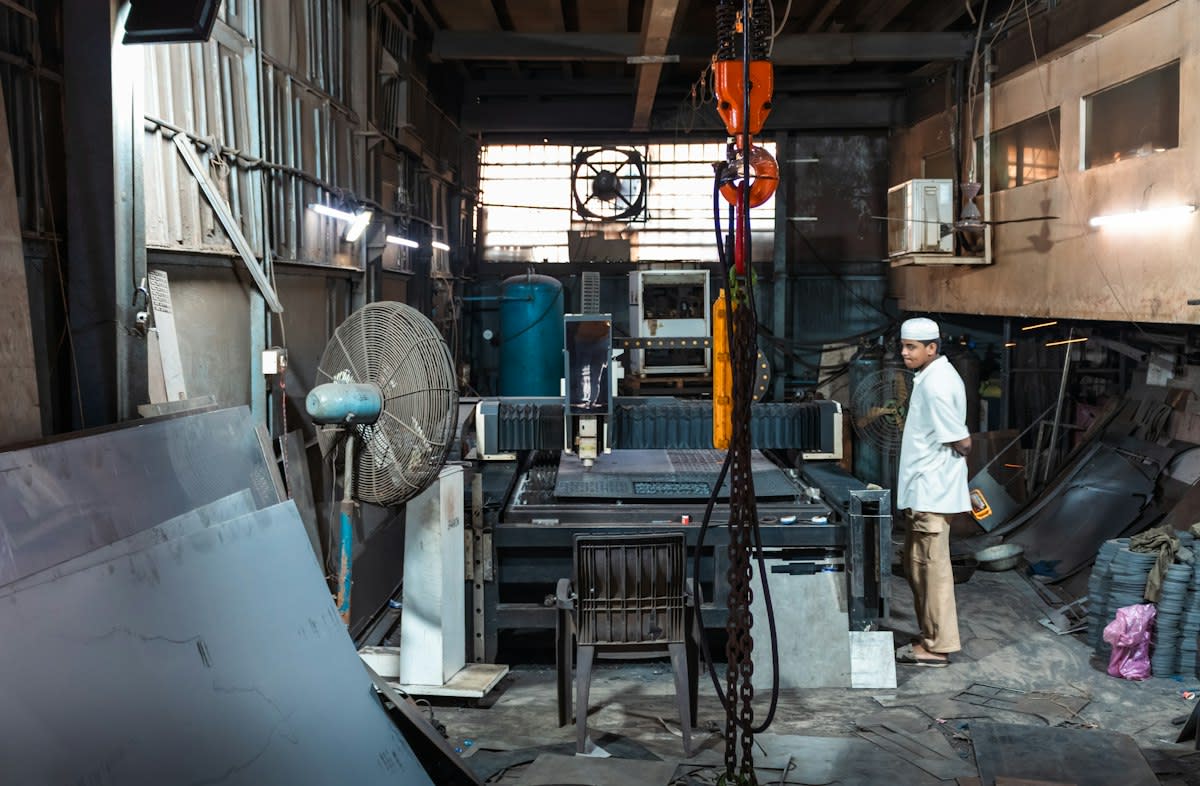 Industrial welding sparks in a factory setting