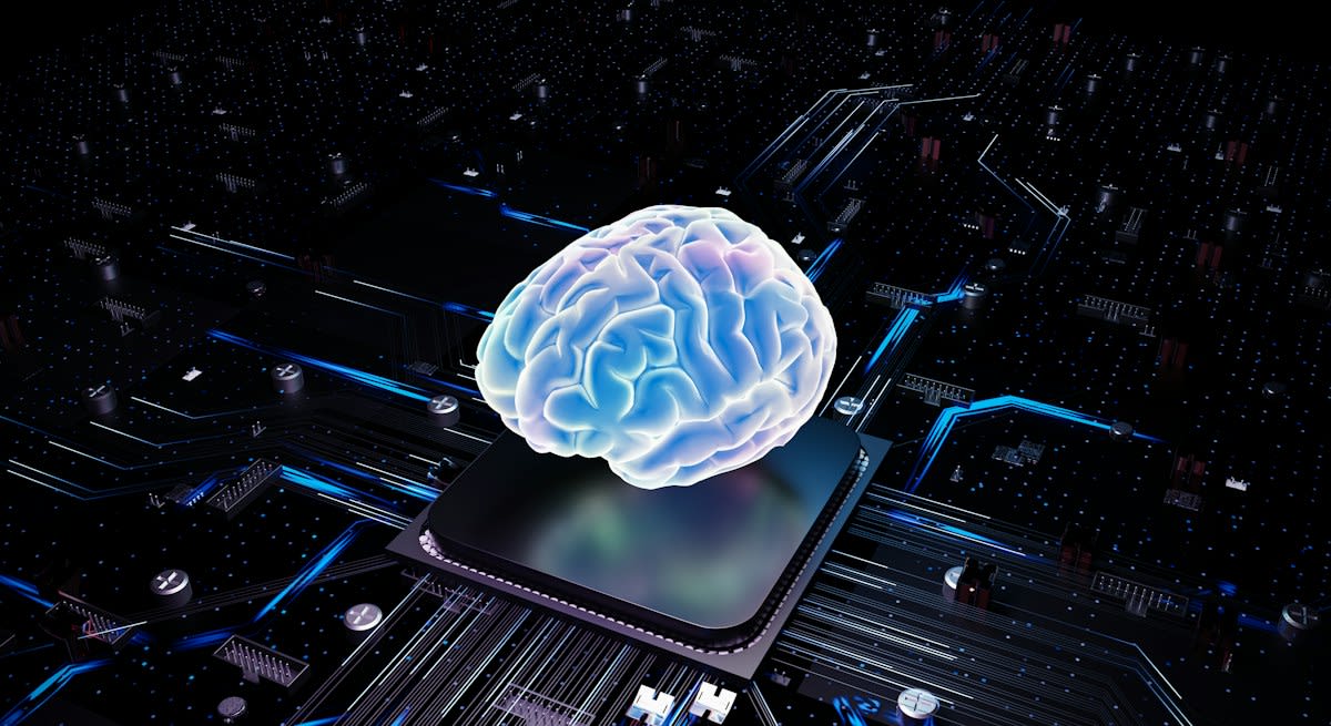 Abstract representation of a human brain connected to digital circuits