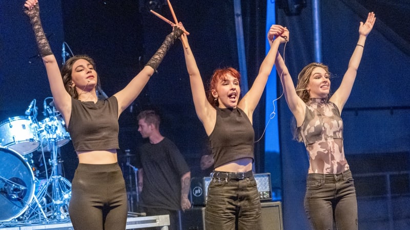 The Warning sisters Daniela, Paulina, and Alejandra Villarreal performing live on stage