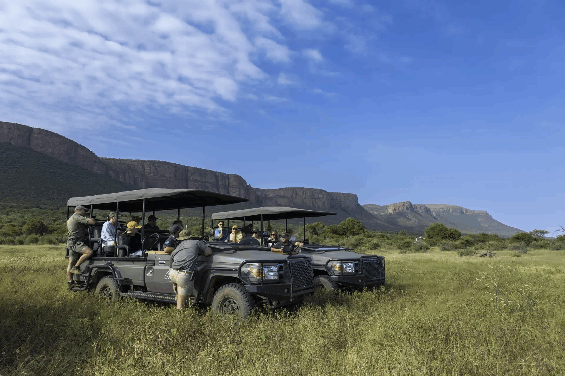 Marataba Rhino Conservation – Game vehicle with ranger and stunning mountain views.