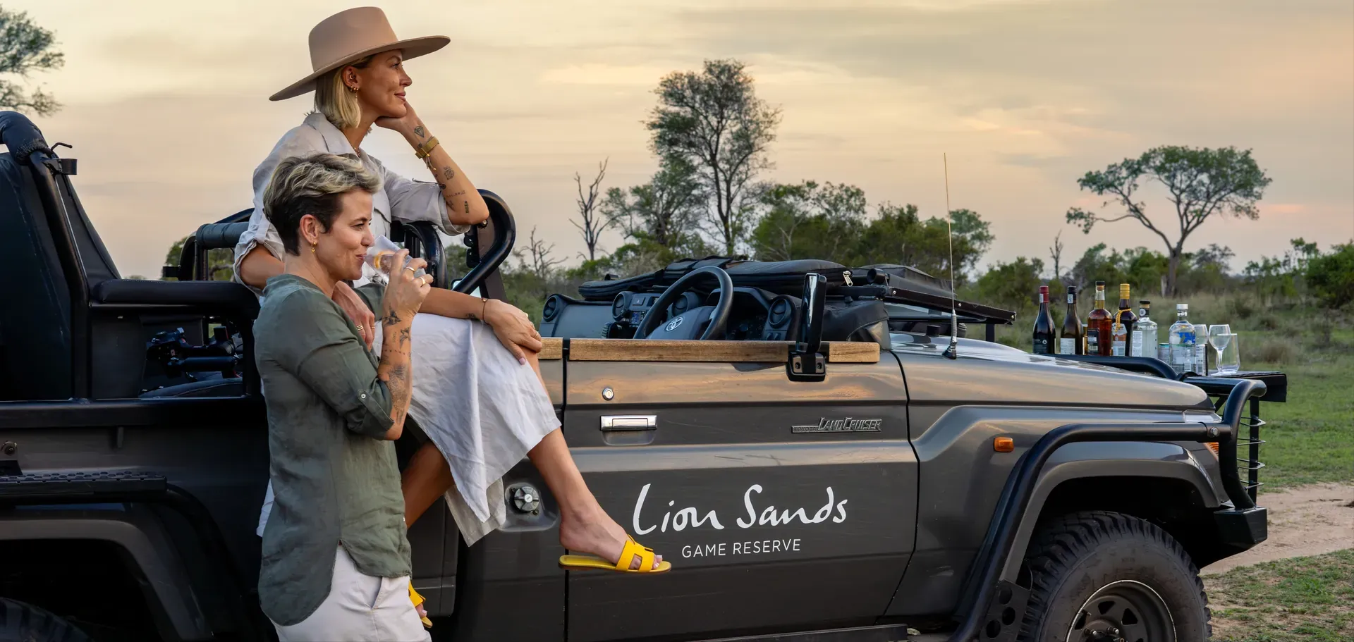 Guests arriving in a private luxury safari vehicle, ensuring privacy and discretion for their journey