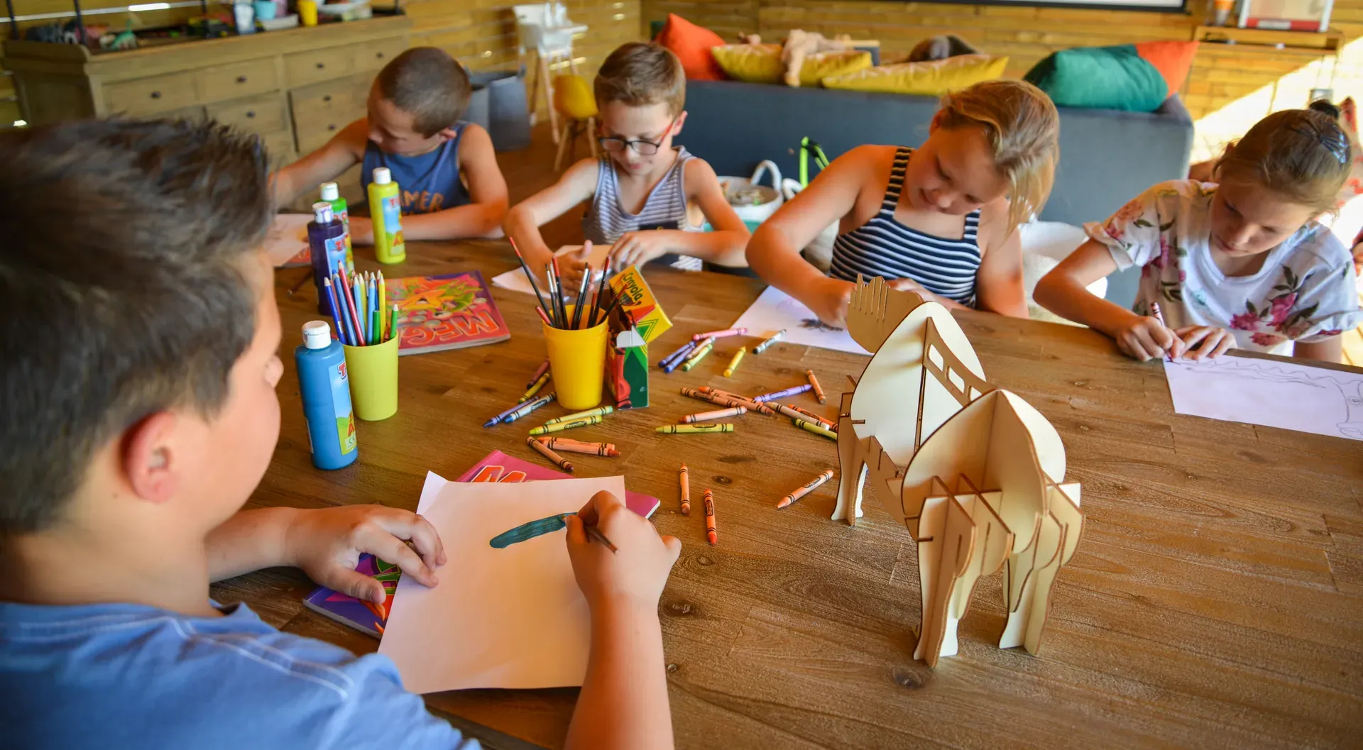 Children drawing as part of a creative activity at Marataba.