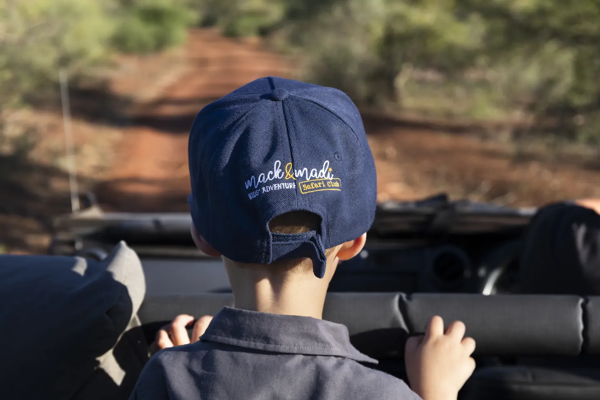 Child on safari at Marataba observing wildlife in the African bush.