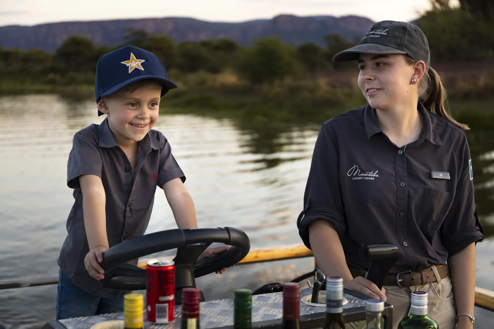 Child driving a boat under ranger supervision at Marataba.