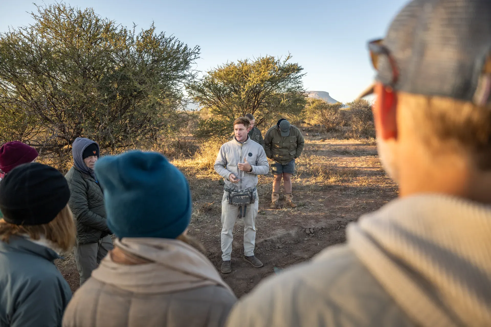 Marataba – Rhino Conservation veterinary procedure with vet briefing guests in the wild.