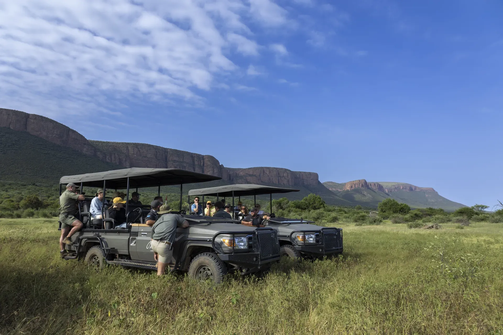 Marataba Rhino Conservation – Game vehicle with ranger and stunning mountain views.