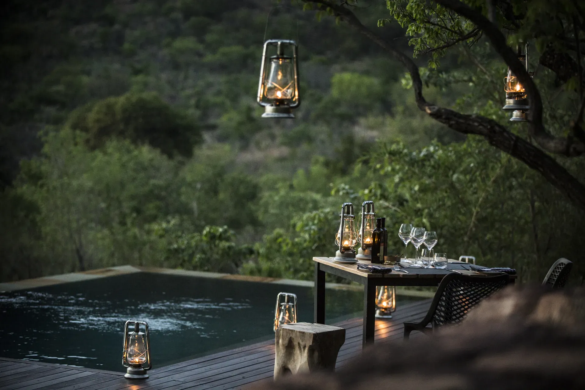 Mountain Lodge pool at Marataba with hanging lanterns at dusk.