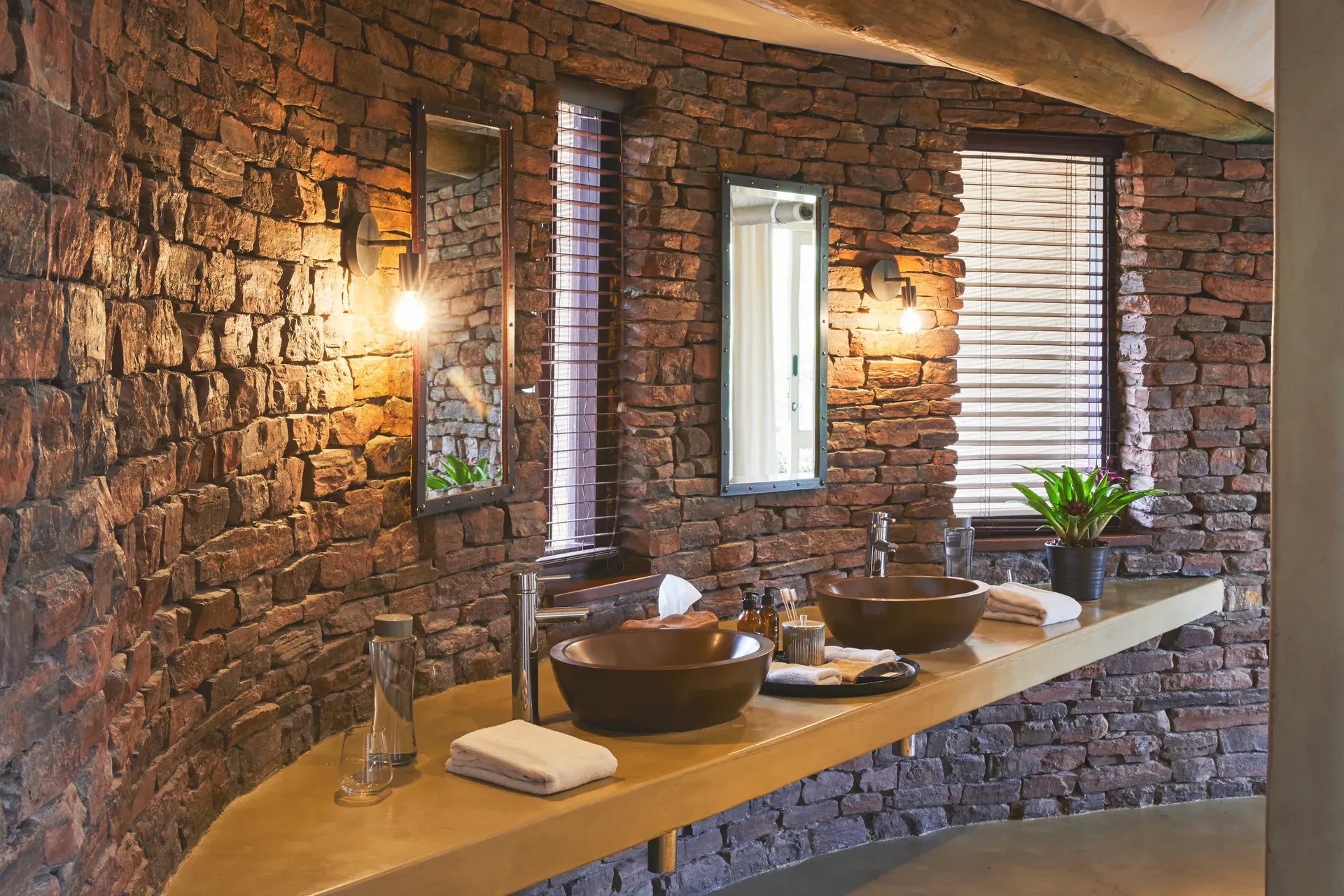 Marataba Safari Lodge – Luxury Tent bathroom with stone wall and double sink.