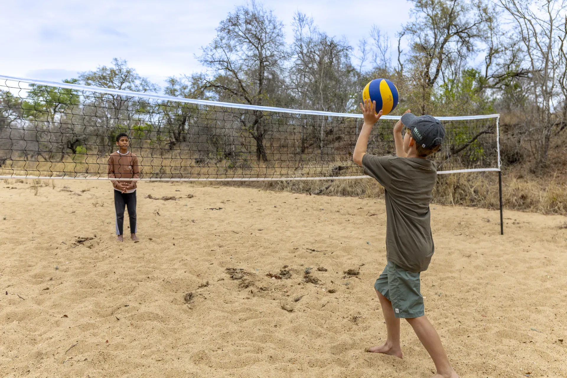 Children playing volleyball in the African bush