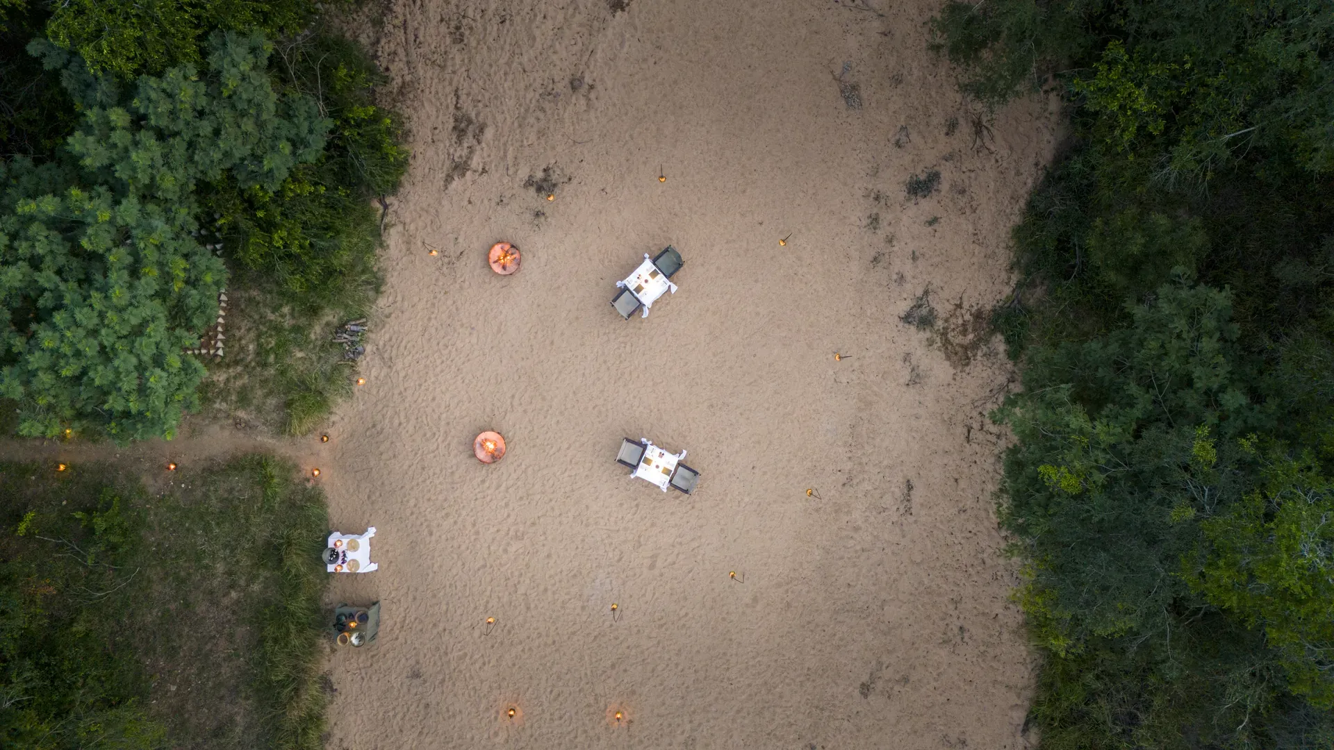 Riverbed dinner setup at Monwana Lodge.