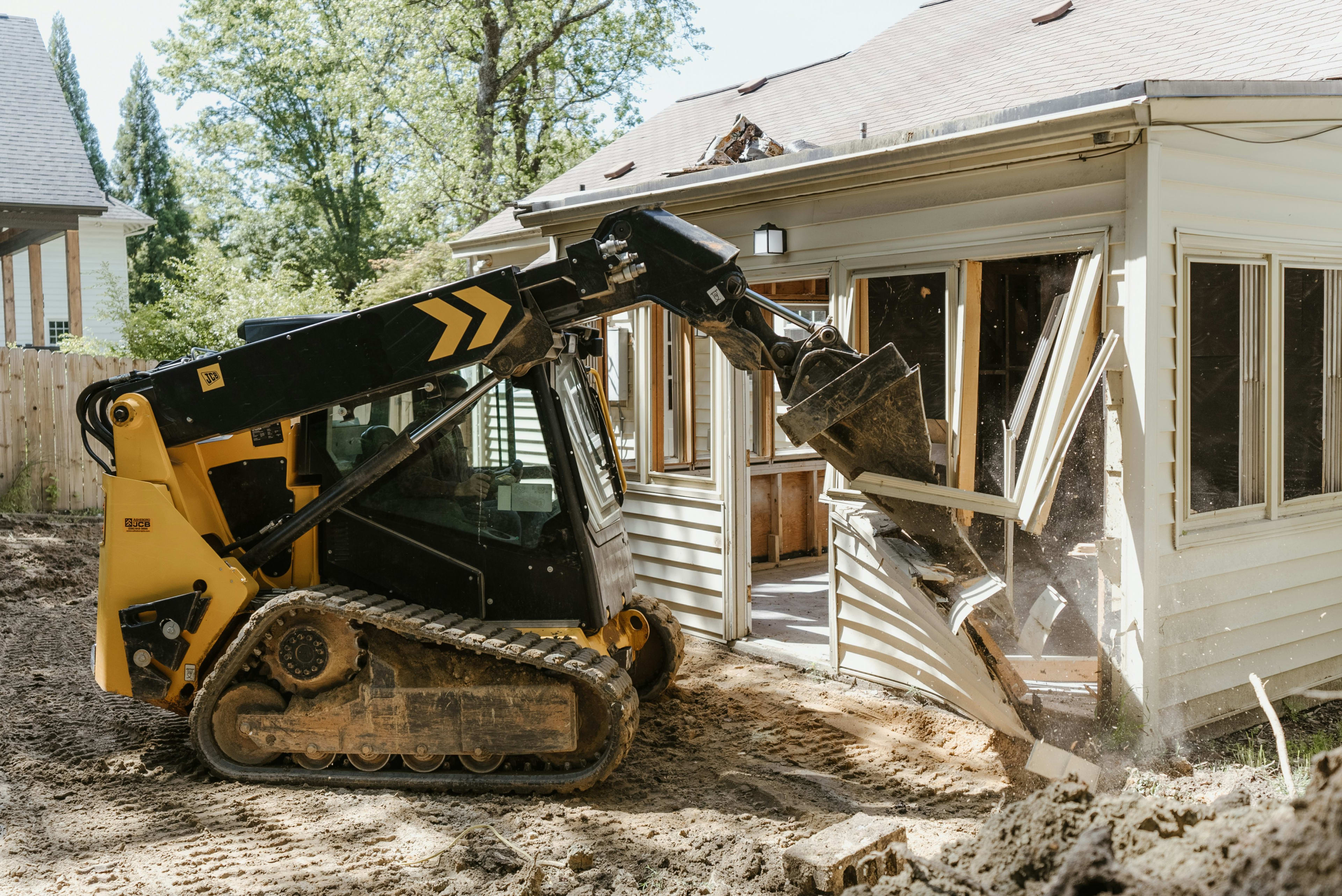 Complete residential house being systematically torn down