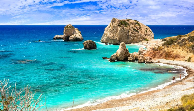 Picture shows Aphrodite's Rock, Cyprus on a warm, sunny beach.