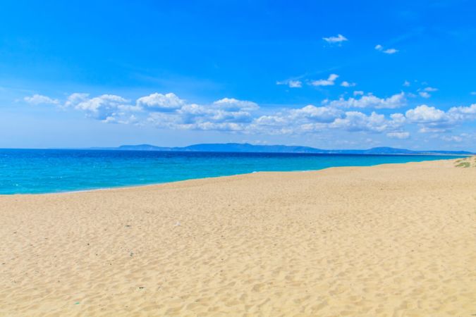 Picture shows as beautigul, white sandy beach with vibrant blue seas. Taken in Comporta Portugal