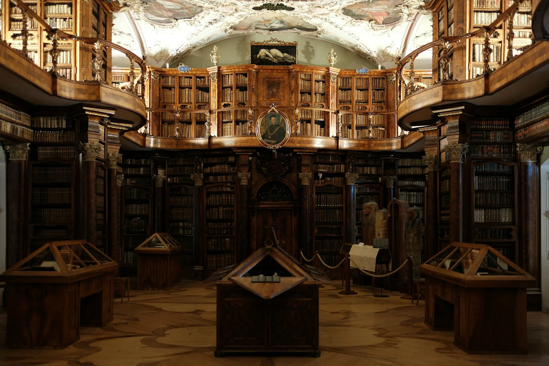 Abbey Library of Saint Gall interior in St. Gallen, Switzerland, featuring ornate wooden bookshelves, curved balconies and historic book collections.