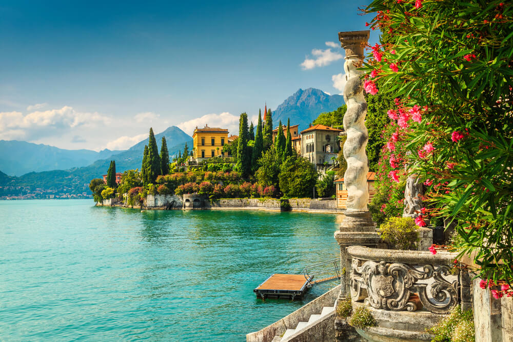 Famous luxury villa Monastero, stunning botanical garden decorated with mediterranean oleander flowers, lake Como, Varenna, Lombardy region, Italy, Europe